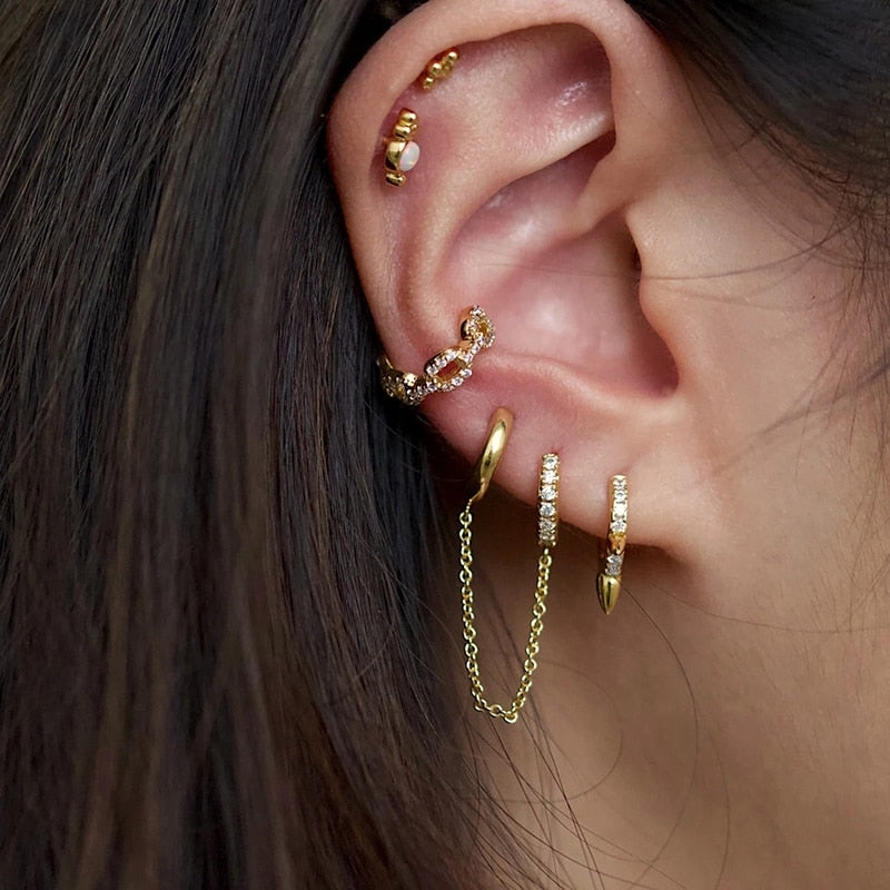 Boucle d'oreille double trou avec zircon blanc
