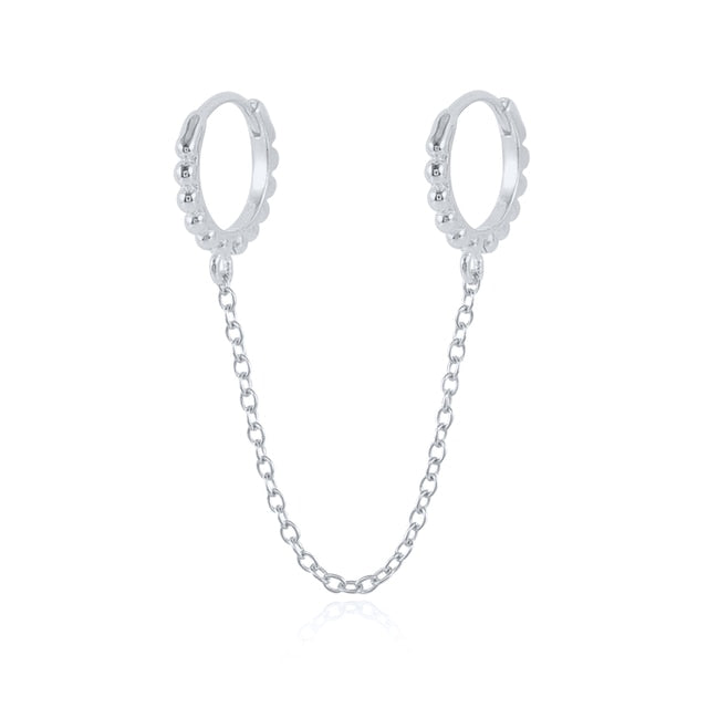 Boucle d'oreille double trou avec zircon blanc