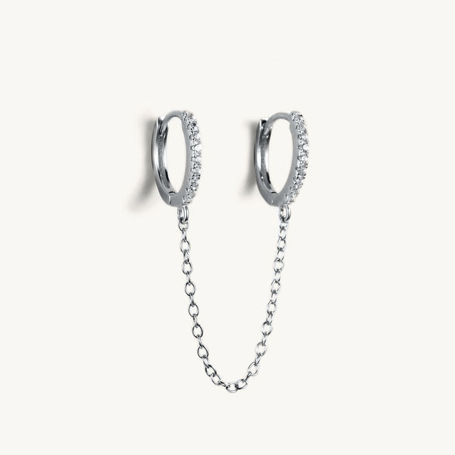 Boucle d'oreille double trou avec zircon blanc