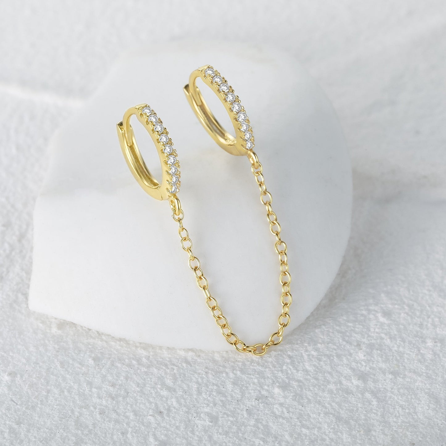 Boucle d'oreille double trou avec zircon blanc