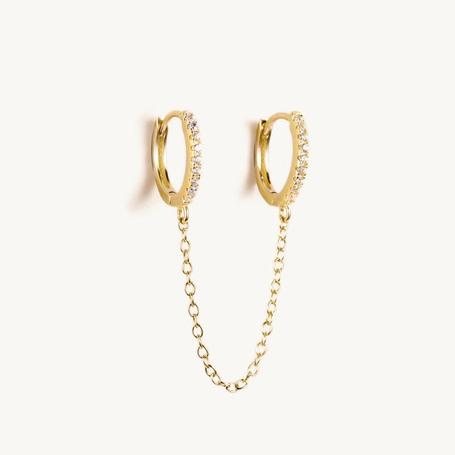 Boucle d'oreille double trou avec zircon blanc
