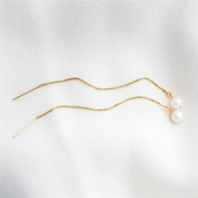 Boucle d’oreille chaine en or avec perle