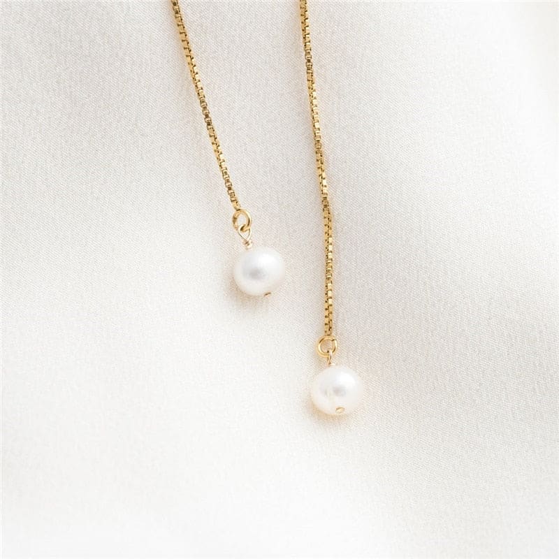 Boucle d’oreille chaine en or avec perle