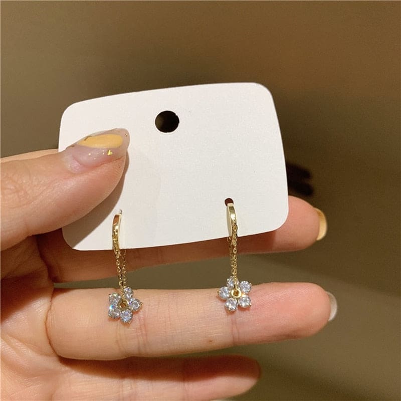 Boucle d’oreille chaine pendante fleur