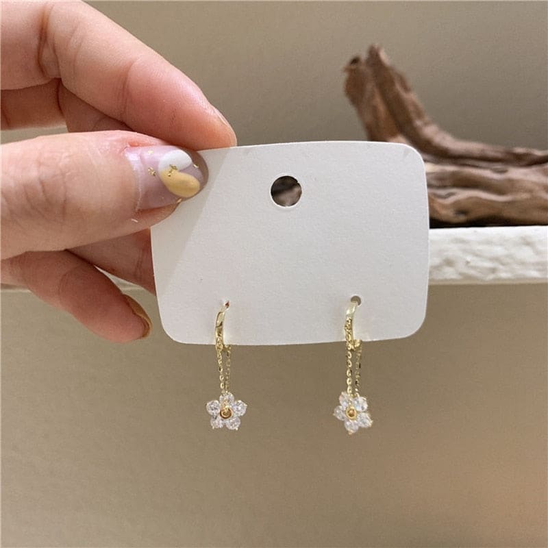 Boucle d’oreille chaine pendante fleur