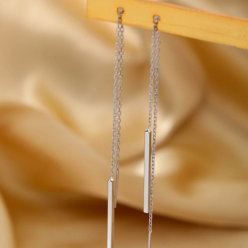 Boucle d’oreille chaine traversante argent