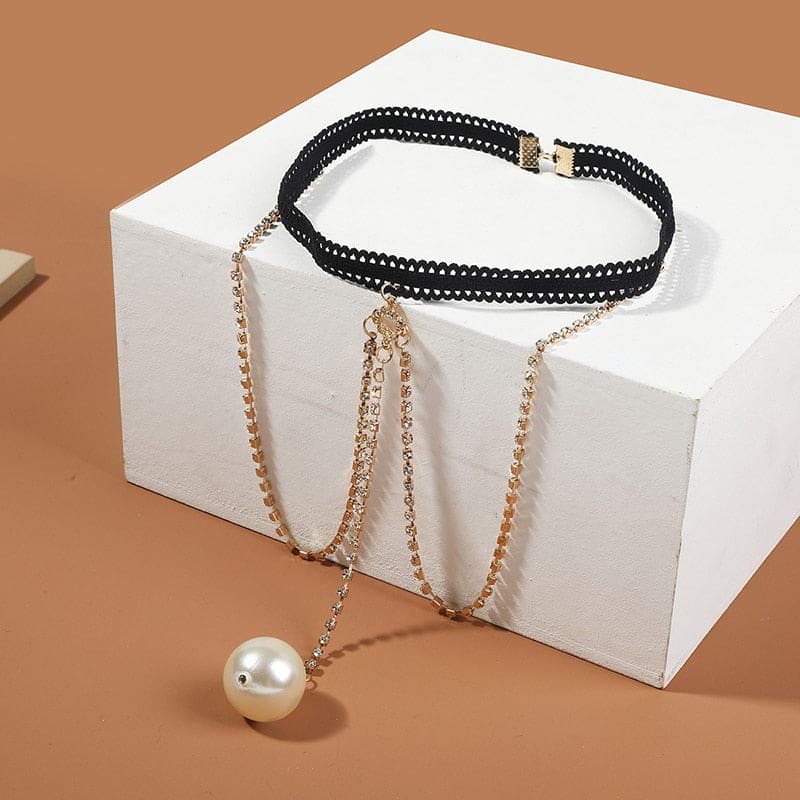 Chaine de cuisse avec grande perle blanche