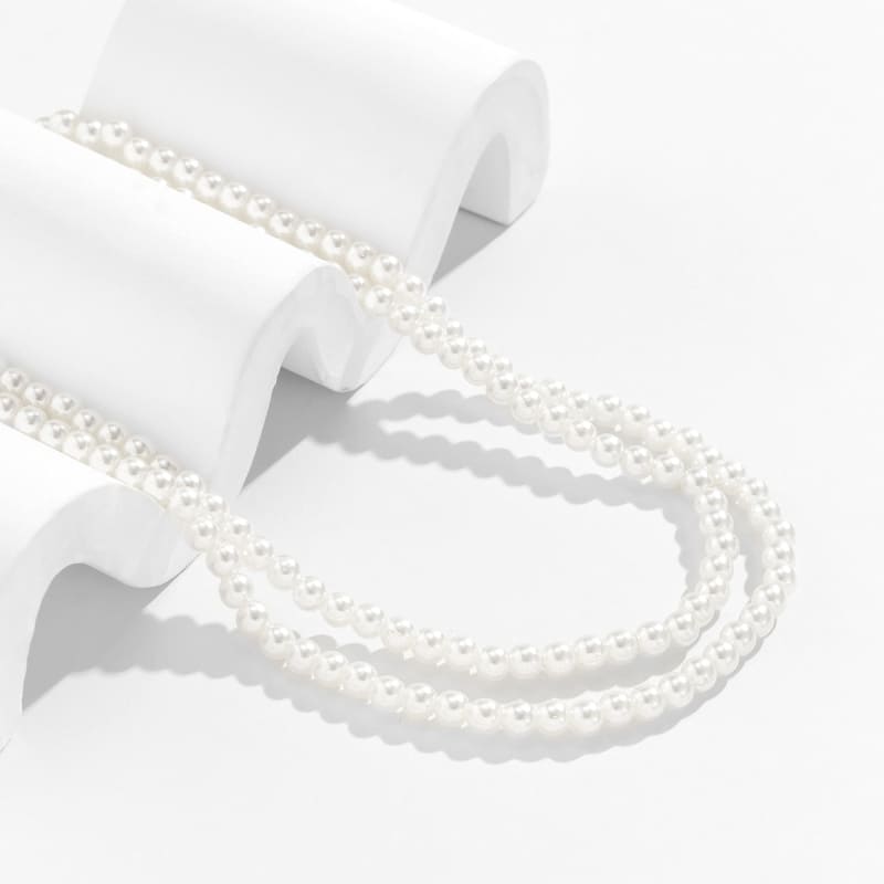 Chaine de cuisse avec perles blanches