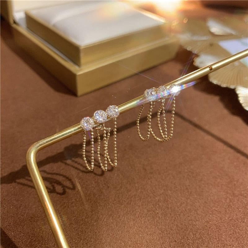 Triple boucle d’oreille chaine