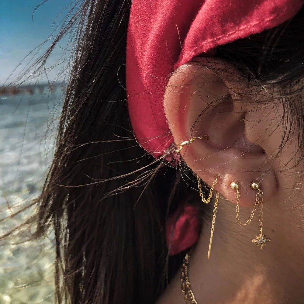 Boucle d'oreille chaine 2 trous pendante avec étoiles