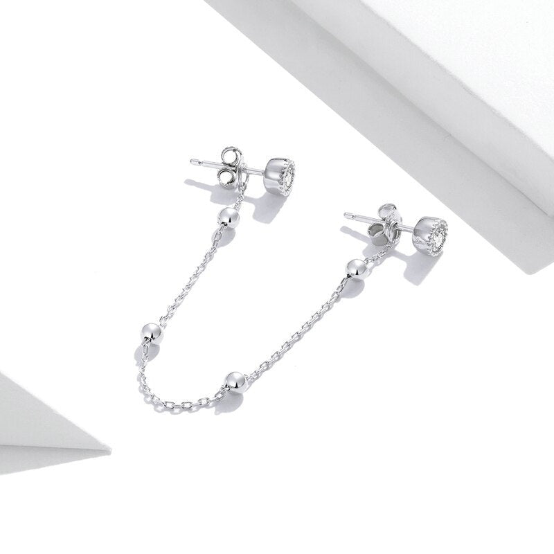 Boucle d'oreille deux trous avec clous et longue chaîne