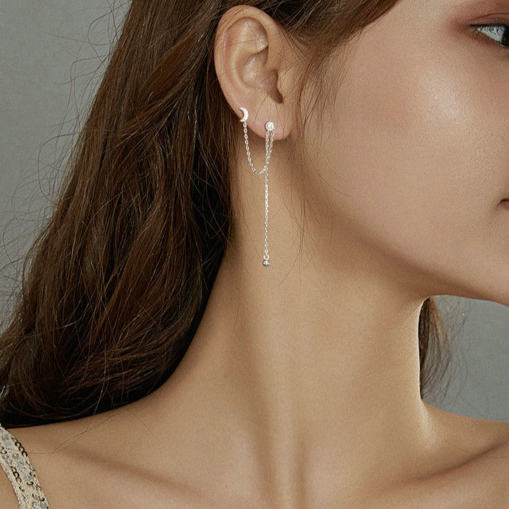 Boucle d'oreille deux trous avec motifs de lune et d'étoiles