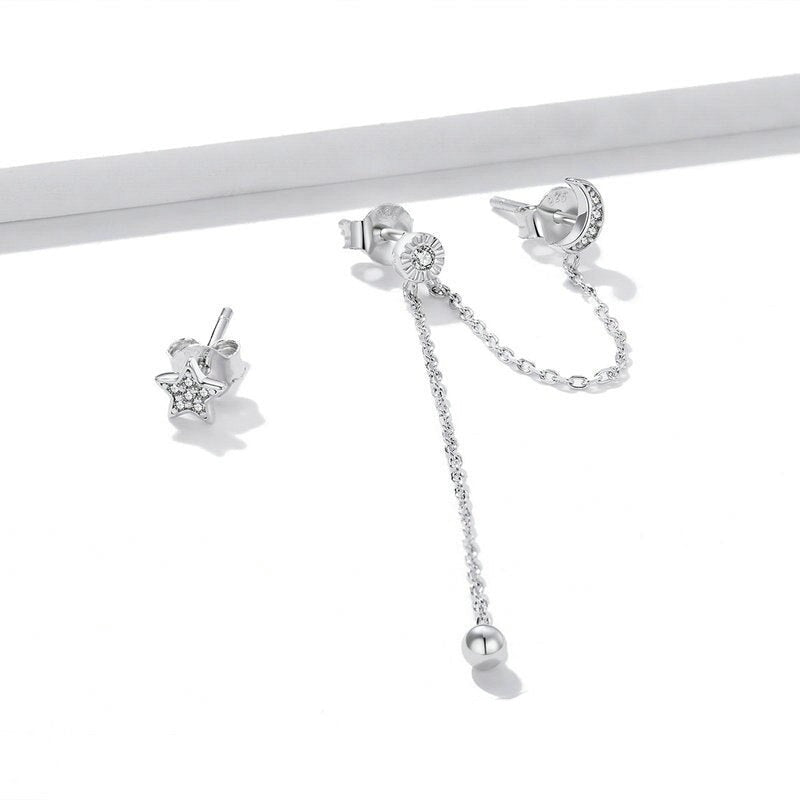 Boucle d'oreille deux trous avec motifs de lune et d'étoiles