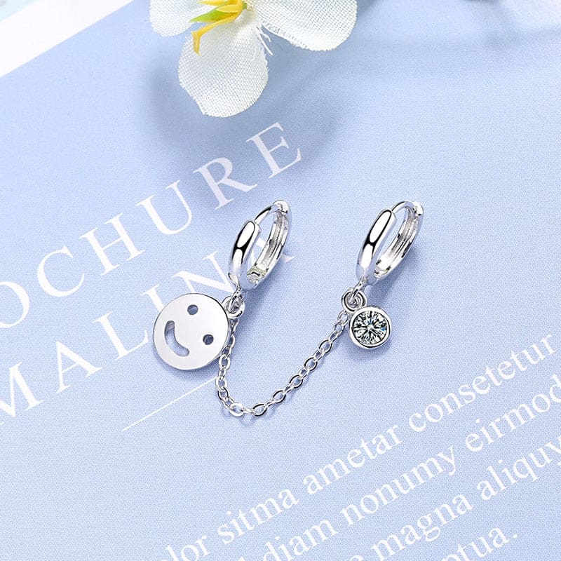 Boucle d’oreille chaine 2 trous visage souriant
