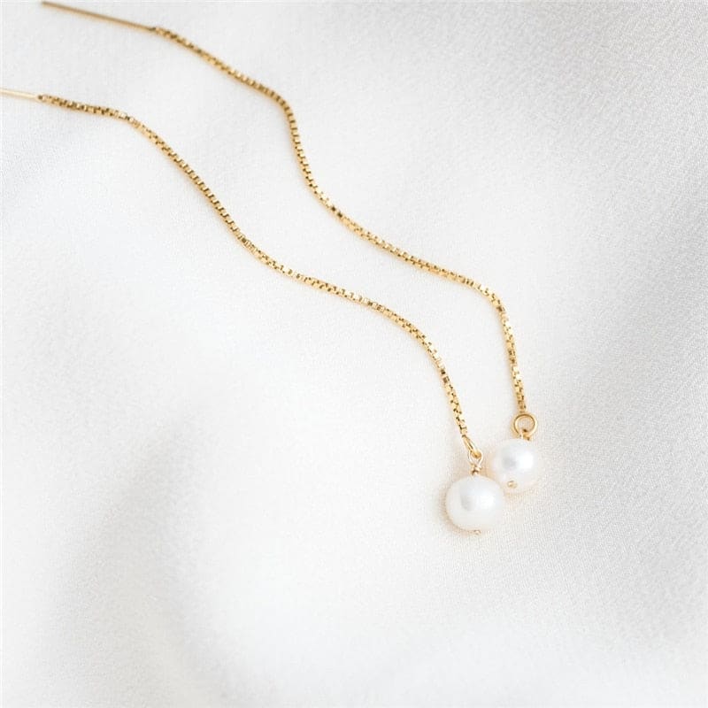 Boucle d’oreille chaine en or avec perle