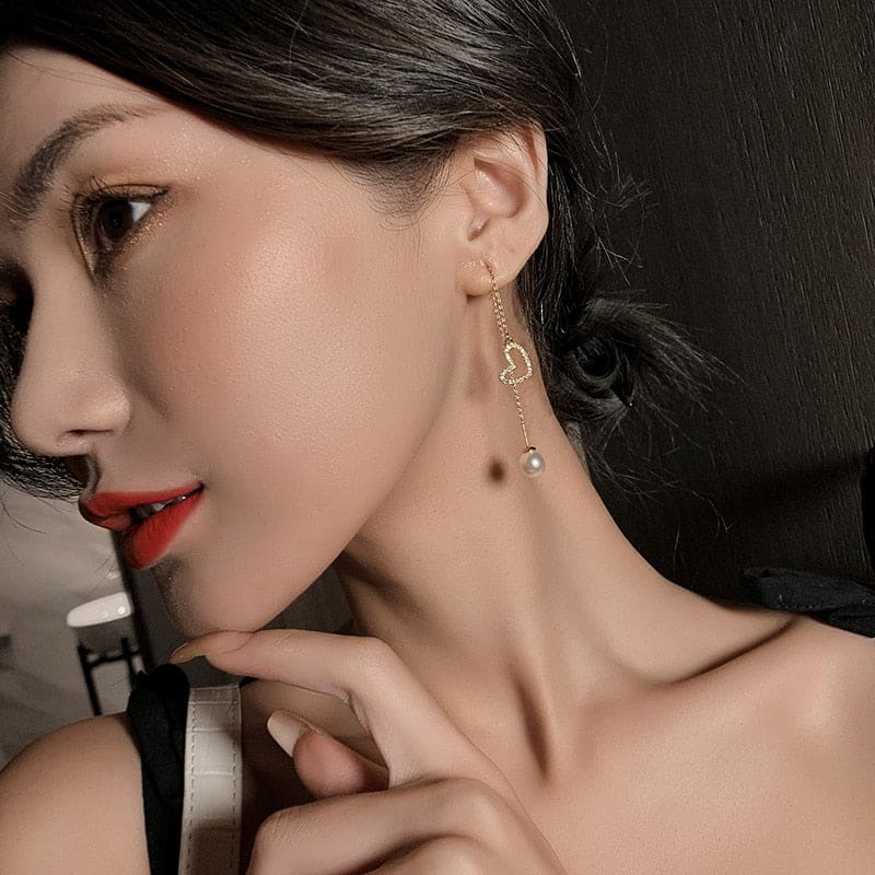 Boucle d’oreille chaine traversante avec coeur