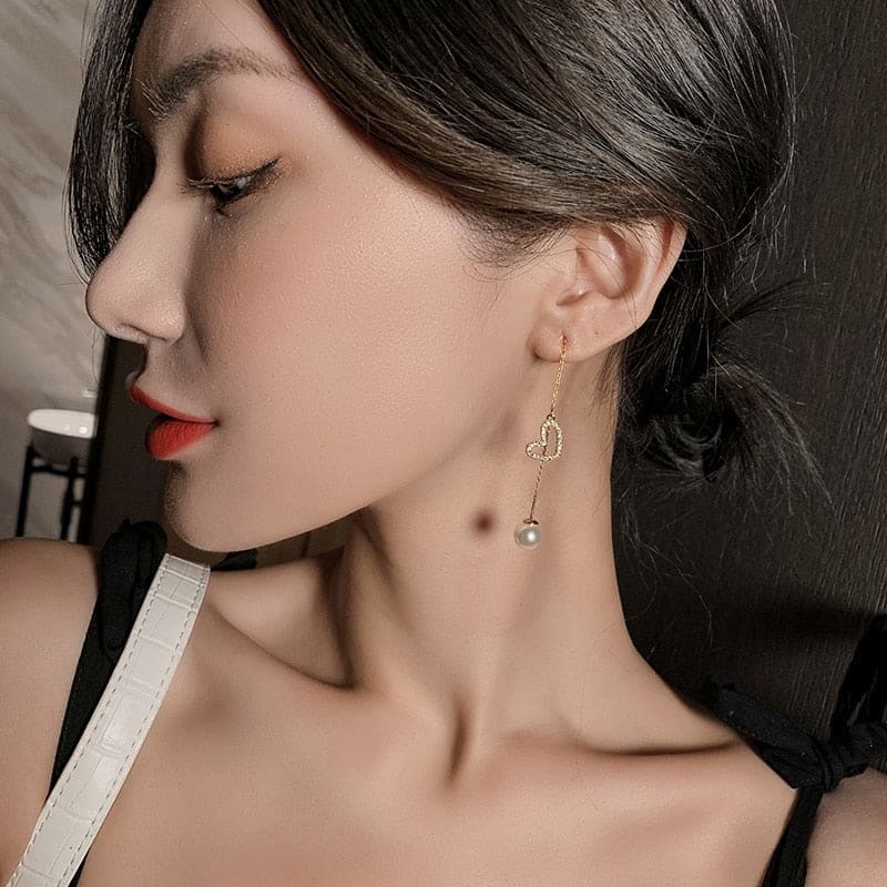 Boucle d’oreille chaine traversante avec coeur