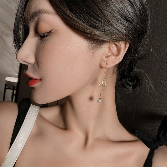 Boucle d’oreille chaine traversante avec coeur