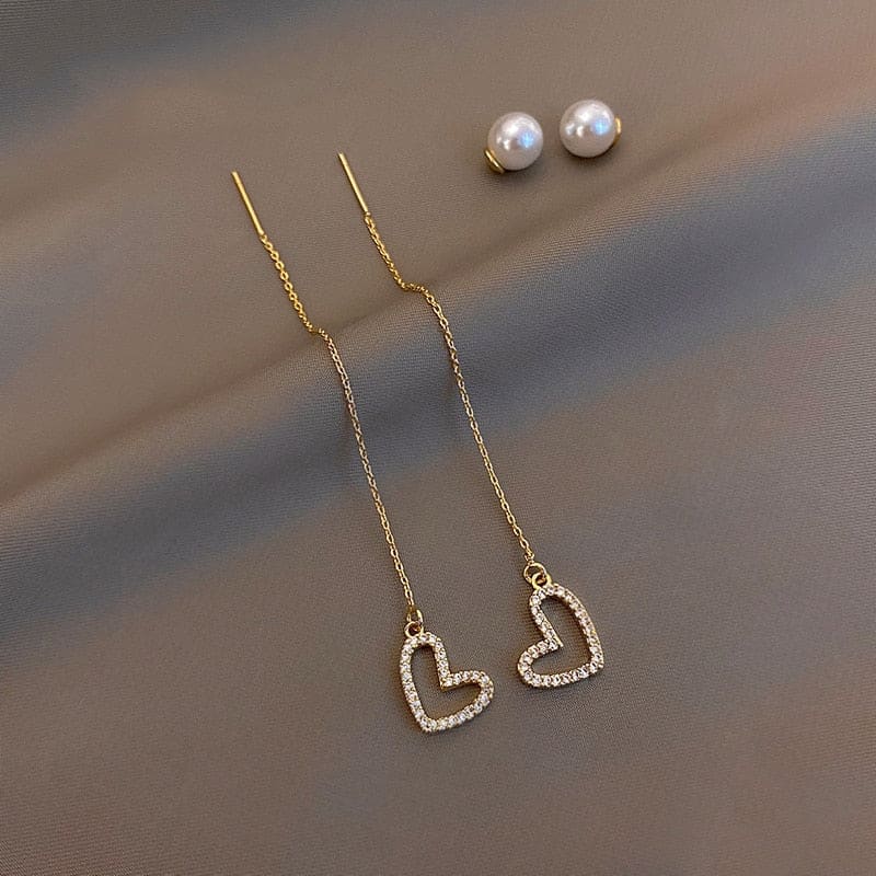 Boucle d’oreille chaine traversante avec coeur