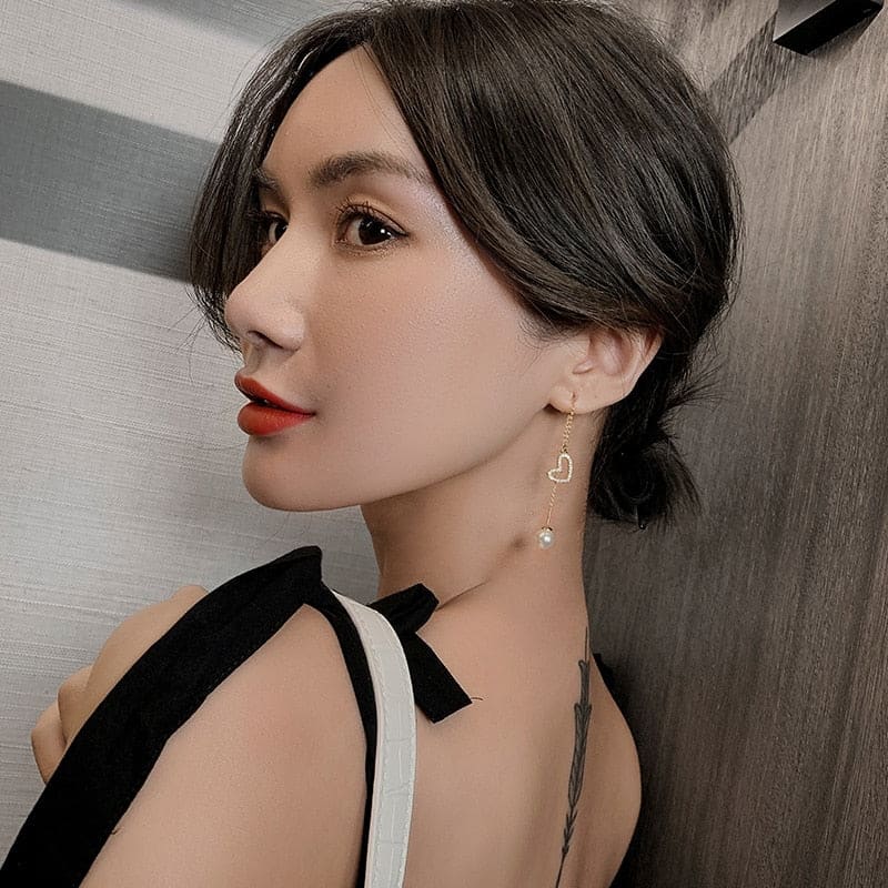 Boucle d’oreille chaine traversante avec coeur