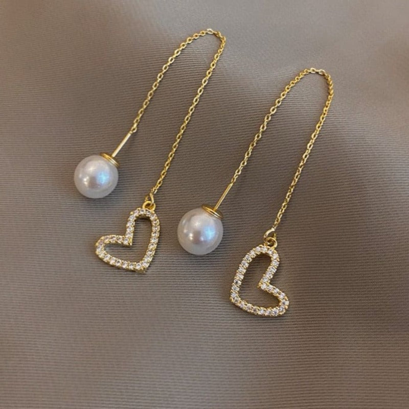 Boucle d’oreille chaine traversante avec coeur