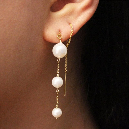 Boucle d’oreille chaine traversante en or avec perle