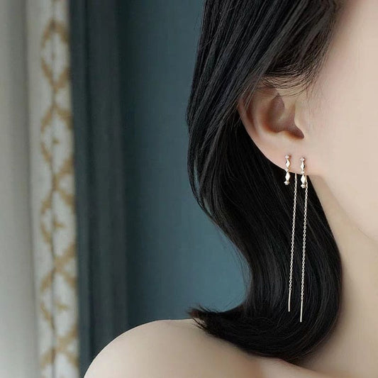 Boucle d’oreille chaine traversante losange doré