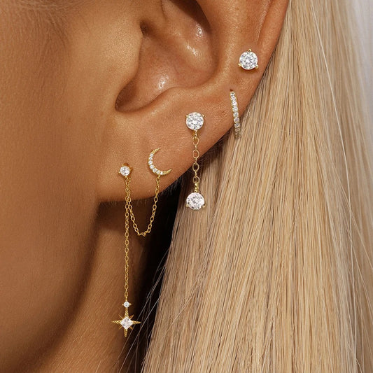 Boucle d'oreille deux trous avec motifs de lune et d'étoiles