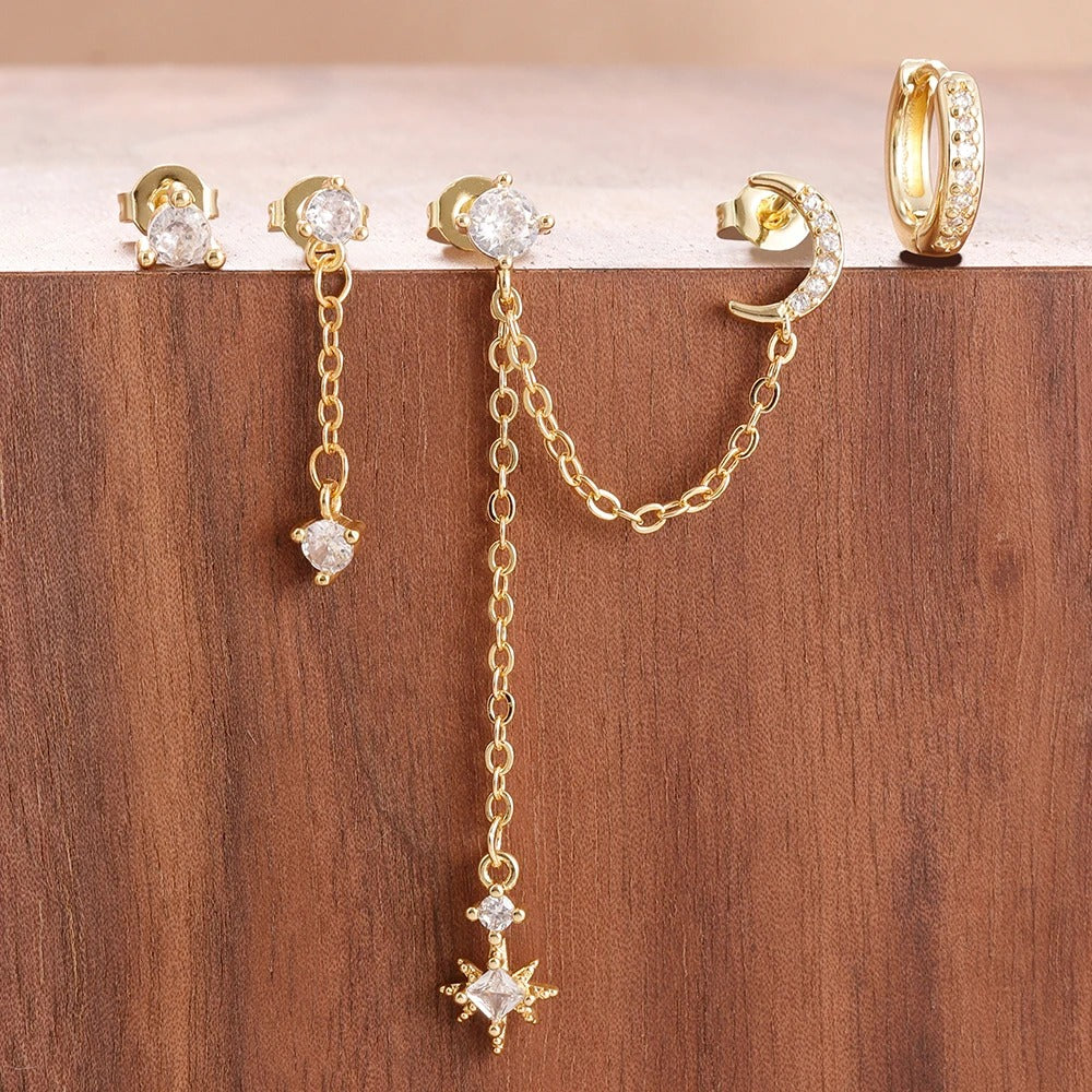 Boucle d'oreille deux trous avec motifs de lune et d'étoiles